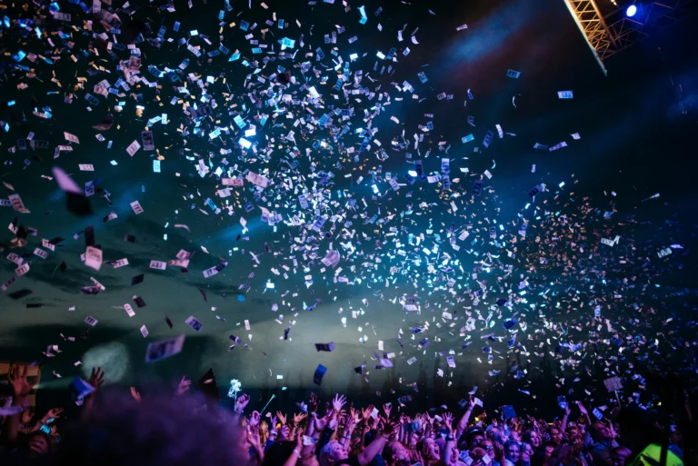 Golden confetti explosion over the champions floor
